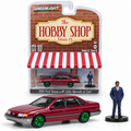 GreenLight The Hobby Shop Série 13 – Ford Taurus 1989 avec vendeur en costume 1:64